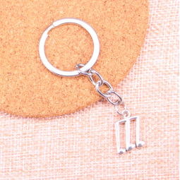 Silver keychain with musical notes