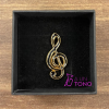 Black treble clef pin